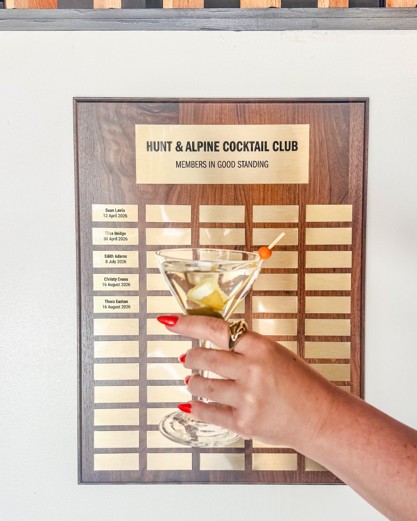 A Cocktail Club challenge coin or plaque